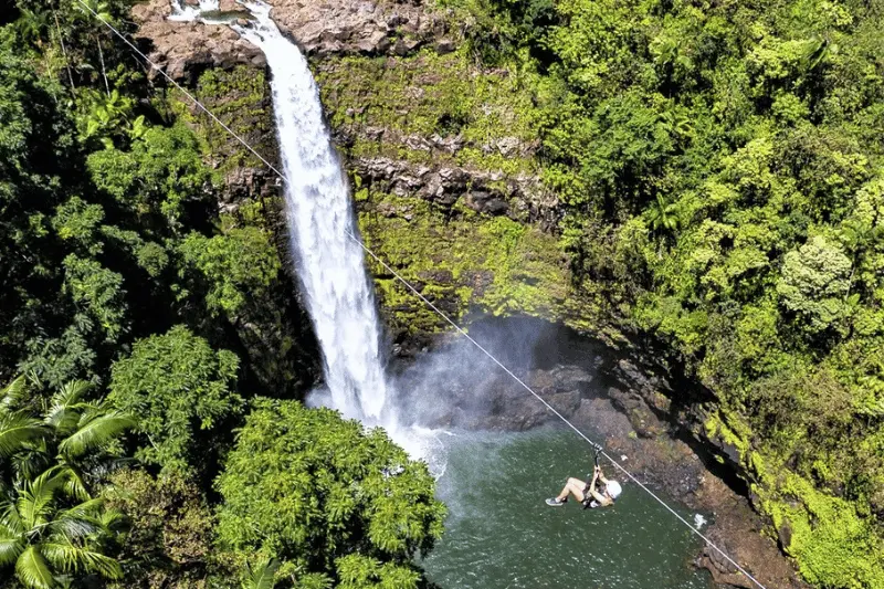 Zipline next to Waterfall in Hawaii