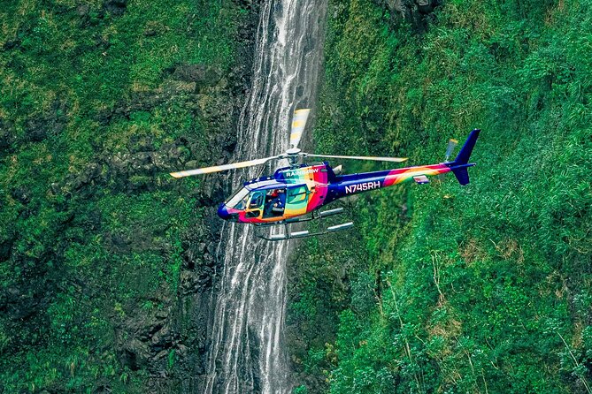 Helicopter in front of Waterfall in Hawaii